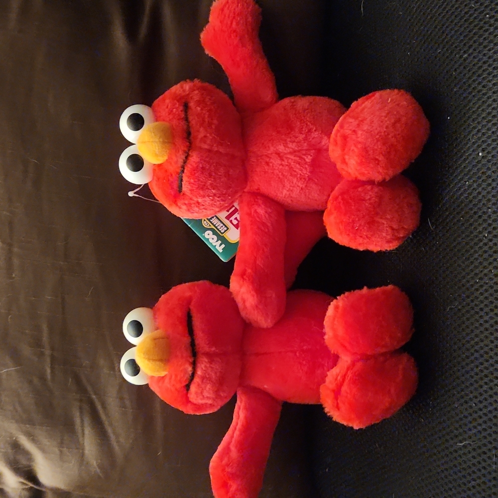 Sesame Street Elmo stuffed animal, 8 Inches Tall.